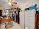 Functional office space with filing cabinets, a desk, and a ceiling fan at 290 Orange Ave, St Cloud, FL 34769