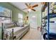 Versatile room with tile flooring, a daybed, natural light, and a ceiling fan at 290 Orange Ave, St Cloud, FL 34769