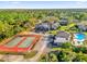 Aerial view showing tennis courts, a pool, parking, and the exterior of the community buildings at 337 Scottsdale Sq # 337, Winter Park, FL 32792