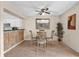 Charming dining area with decorative mirror and seating for four at 337 Scottsdale Sq # 337, Winter Park, FL 32792