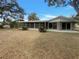 Home's backyard featuring a screened porch and ample outdoor space at 38 Emerald Ct, Ocala, FL 34472