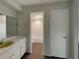Bathroom boasts modern fixtures and a well-lit shower, blending functionality with style at 38 Emerald Ct, Ocala, FL 34472