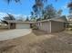 Charming single-story home featuring a long driveway and attached two-car garage at 38 Emerald Ct, Ocala, FL 34472