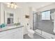 Bathroom featuring granite countertops, a single sink vanity, and an enclosed shower at 3811 Lana Ave, Davenport, FL 33897