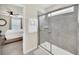 Bathroom featuring an enclosed shower with gray tile and view of a bedroom in the background at 3811 Lana Ave, Davenport, FL 33897