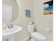 Bathroom with a modern sink and faucet, round mirror and neutral wall paint at 3811 Lana Ave, Davenport, FL 33897