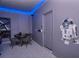 Home game room with a round table, chairs and a Star Wars R2-D2 replica at 3811 Lana Ave, Davenport, FL 33897
