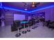 Entertainment room with home movie theater, bar tables, and blue lighting at 3811 Lana Ave, Davenport, FL 33897