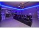 Spectacular home theater with tiered seating, projector, and Star Wars themed decor at 3811 Lana Ave, Davenport, FL 33897