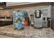 Granite counter with a stainless steel keurig coffee maker and coffee pods at 3811 Lana Ave, Davenport, FL 33897