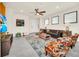 Bright living room featuring modern decor, a comfortable leather sofa, and ample natural light at 3811 Lana Ave, Davenport, FL 33897