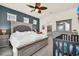 Comfortable main bedroom with elegant furniture, a ceiling fan, and modern decor at 3811 Lana Ave, Davenport, FL 33897