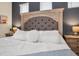 Close-up of bed in the main bedroom with comfortable pillows and side tables at 3811 Lana Ave, Davenport, FL 33897