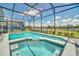 Screened-in pool and spa in backyard of home; safety fence included at 3811 Lana Ave, Davenport, FL 33897