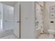 Bathroom featuring a shower/tub combo, toilet, and storage closet across from an open door at 3862 Royal Azalea Way, Sanford, FL 32773