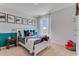 Vibrant ' bedroom with shark-themed decor, a comfortable bed, and soft lighting at 3862 Royal Azalea Way, Sanford, FL 32773
