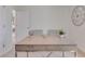 Minimalist office space with a sleek desk and chair, ideal for a focused work environment at 3862 Royal Azalea Way, Sanford, FL 32773