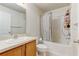 Bathroom featuring a toilet, bath tub and single sink at 3995 Sw 57Th Ct, Ocala, FL 34474
