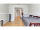 Cozy bedroom with hardwood floors and a view into another room at 3995 Sw 57Th Ct, Ocala, FL 34474