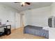 Bedroom featuring a large window, hardwood floors, and a ceiling fan at 3995 Sw 57Th Ct, Ocala, FL 34474