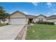 Charming single-story home featuring a two-car garage, well-maintained lawn and garden, and a welcoming entryway at 3995 Sw 57Th Ct, Ocala, FL 34474