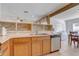 View of the kitchen featuring a stainless steel dishwasher and a sink at 3995 Sw 57Th Ct, Ocala, FL 34474