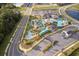 Aerial view of resort-style community pool area featuring a lazy river and clubhouse at 4374 Rhyme St, Kissimmee, FL 34746