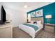 Cozy bedroom with a modern aesthetic, including stylish décor and ample natural light at 4374 Rhyme St, Kissimmee, FL 34746