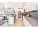 Modern kitchen with stainless appliances, tile backsplash, and kitchen island at 4374 Rhyme St, Kissimmee, FL 34746