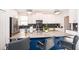 Modern kitchen with stainless appliances, pendant lighting, and bar stool seating at 4374 Rhyme St, Kissimmee, FL 34746