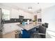 Modern kitchen with stainless appliances, pendant lighting, and bar stool seating at 4374 Rhyme St, Kissimmee, FL 34746