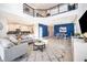 Bright, open-concept living room with modern decor, flowing into dining and kitchen areas at 4374 Rhyme St, Kissimmee, FL 34746