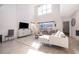 Spacious living room with high ceilings, a textured accent wall, and views of the pool area at 4374 Rhyme St, Kissimmee, FL 34746