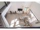 Sun-filled living room boasts soaring ceilings, neutral decor, and a comfortable sectional sofa at 4374 Rhyme St, Kissimmee, FL 34746