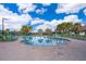 A beautiful community pool area with plenty of seating for residents to enjoy the Florida sunshine at 4374 Rhyme St, Kissimmee, FL 34746