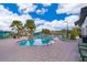 A luxurious community pool is surrounded by lush landscaping and comfortable lounge chairs for relaxation at 4374 Rhyme St, Kissimmee, FL 34746