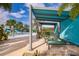 Community pool area with lounge chairs, palm trees, and shade cabanas, perfect for relaxing and enjoying sunny days at 4374 Rhyme St, Kissimmee, FL 34746