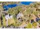 Aerial view of the house showing a lake and gorgeous greenery at 530 Mckenzie Rd, Lake Helen, FL 32744