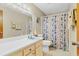 Functional bathroom with a shower-tub combo, complemented by a single sink vanity and neutral decor at 530 Mckenzie Rd, Lake Helen, FL 32744