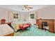 Cozy bedroom with a ceiling fan and a desk area, complemented by matching vintage furniture at 530 Mckenzie Rd, Lake Helen, FL 32744