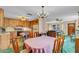 Dining area open to the kitchen, with wood cabinets and modern appliances, blending dining and cooking at 530 Mckenzie Rd, Lake Helen, FL 32744
