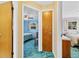 Hallway offering views into bedrooms, showcasing layout and connectivity within the home at 530 Mckenzie Rd, Lake Helen, FL 32744