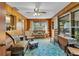 Comfortable living room with wood paneled walls and natural light at 530 Mckenzie Rd, Lake Helen, FL 32744