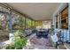 Screened patio with brick floor, ceiling fan and outdoor seating at 530 Mckenzie Rd, Lake Helen, FL 32744