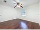 Bedroom featuring hardwood floors, a ceiling fan, natural light, and a neutral color palette at 5619 Pinerock Rd, Orlando, FL 32810