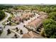 Aerial view of the community highlighting the street layout, pond, and overall neighborhood at 8141 Roseville Blvd, Davenport, FL 33896