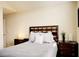 Comfortable bedroom featuring a wooden headboard and soft, inviting bedding at 8141 Roseville Blvd, Davenport, FL 33896