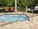 Inviting hot tub area with seating, perfect for relaxation and enjoying the outdoors at 8141 Roseville Blvd, Davenport, FL 33896