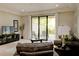 Cozy living room with sliding glass doors leading to an outdoor patio at 8141 Roseville Blvd, Davenport, FL 33896