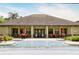 Community pool area features ample seating and stylish patio umbrellas at 8141 Roseville Blvd, Davenport, FL 33896